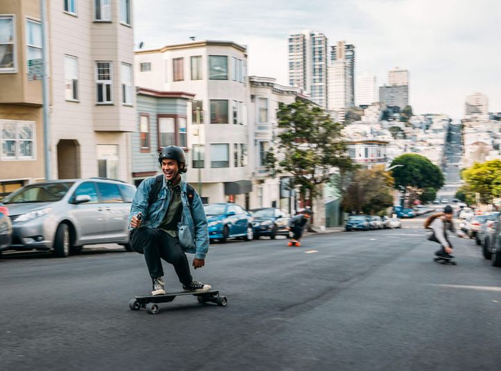 Skateboarder riding down a San Francisco street