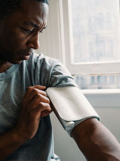 Man fitting a wearable sleeve on his arm